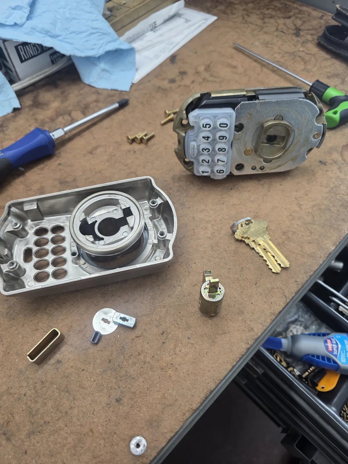 Residential keypad deadbolt being serviced by a locksmith in St. Petersburg, FL